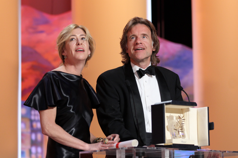 Producers Bill Pohlad and Dede Gardner accept the Palme D’Or on Malick’s behalf. (Photo: Getty)